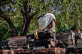 Ayutthaya, Thailand. Wat Phra Ram, headless Buddha statue of the west viharn.